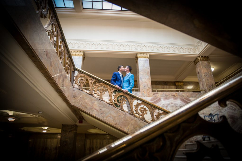 Couple kissing on stairs 