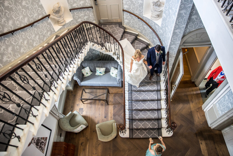 Couple walking down staircase 