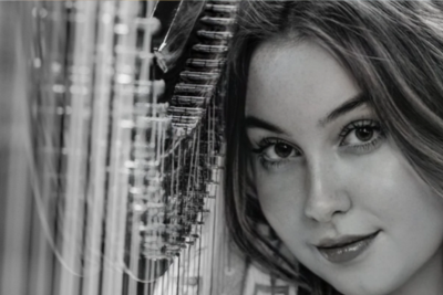 Picture of Amie True with her Harp Smiling 