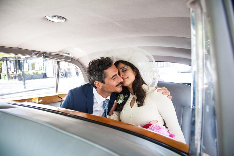 Bride and Groom Hugging in Car
